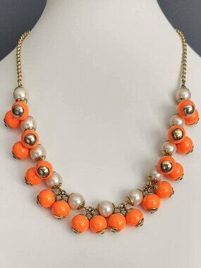 Bright orange and faux pearl cluster necklace